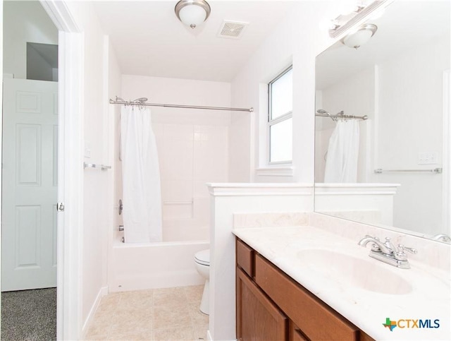 bathroom with visible vents, toilet, shower / bath combo, vanity, and tile patterned floors