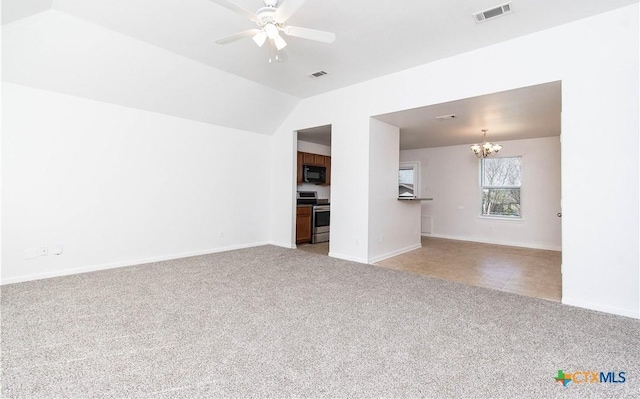 unfurnished living room featuring visible vents, baseboards, light colored carpet, lofted ceiling, and ceiling fan with notable chandelier