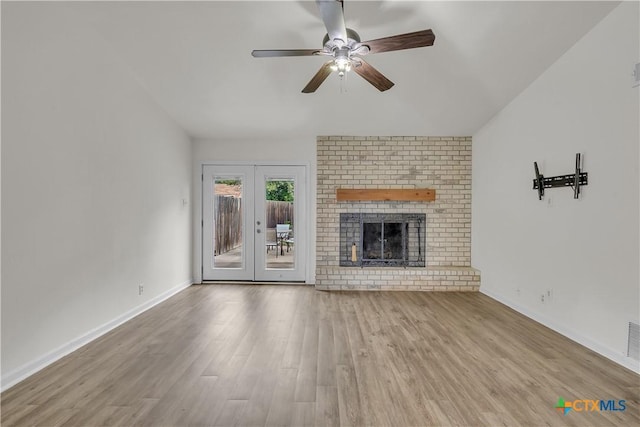 2002 Buckskin Trl, Temple, TX 76502 - unfurnished living room featuring a ceiling fan, wood finished floors, french doors, baseboards, and lofted ceiling
