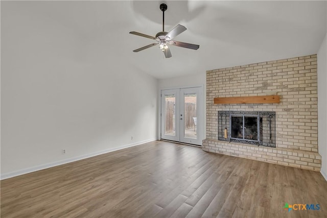 2002 Buckskin Trl, Temple, TX 76502 - unfurnished living room with wood finished floors, lofted ceiling, a ceiling fan, baseboards, and french doors