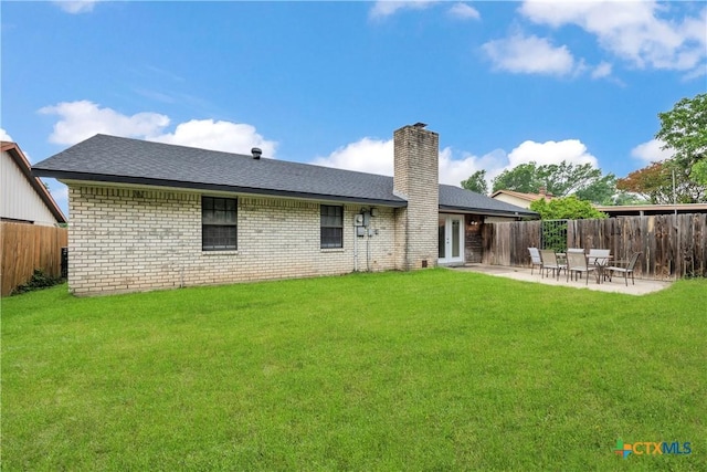 2002 Buckskin Trl, Temple, TX 76502 - rear view of house featuring a chimney, a patio area, a shingled roof, and brick siding