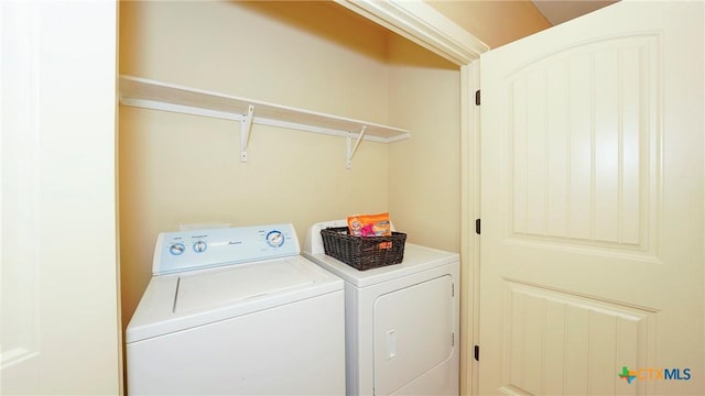 washroom featuring washer and dryer