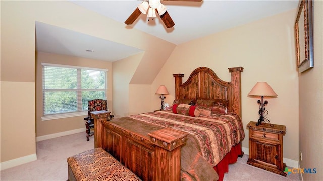 bedroom with ceiling fan, light carpet, and lofted ceiling