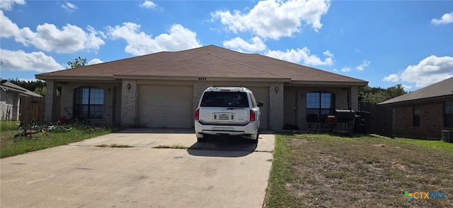 single story home with a garage