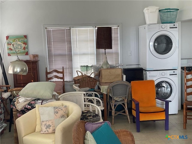 clothes washing area with stacked washer / drying machine