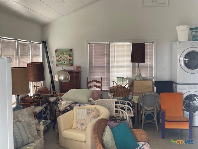 interior space featuring stacked washer and clothes dryer