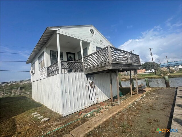 view of property exterior featuring a wooden deck