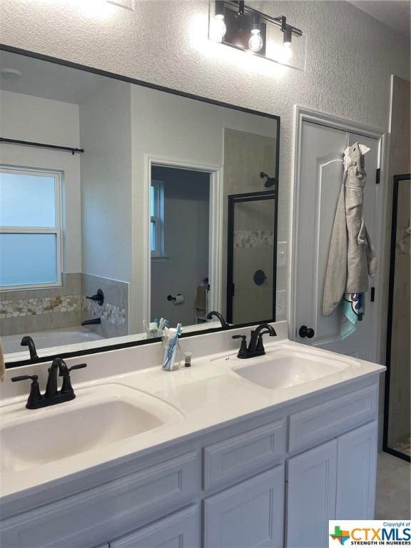 bathroom featuring vanity and plus walk in shower