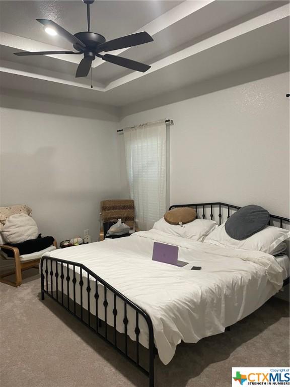 bedroom featuring carpet floors and ceiling fan