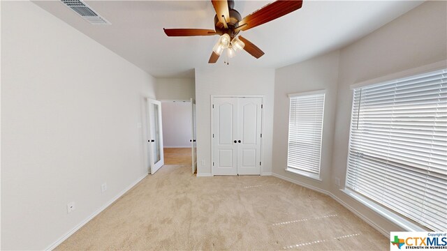 808 Dred Roger Cir, Killeen, TX 76542 - unfurnished bedroom featuring light carpet, baseboards, and ceiling fan
