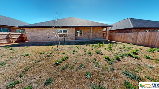 rear view of house with a patio area