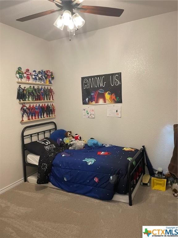 bedroom featuring ceiling fan and carpet floors