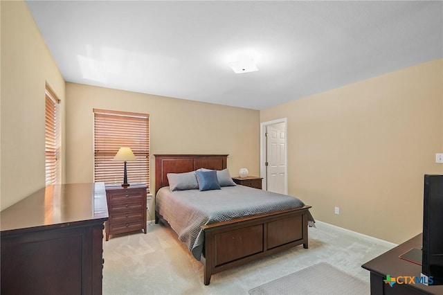 bedroom with light carpet