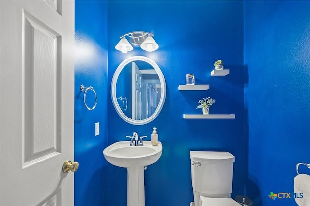 bathroom featuring toilet