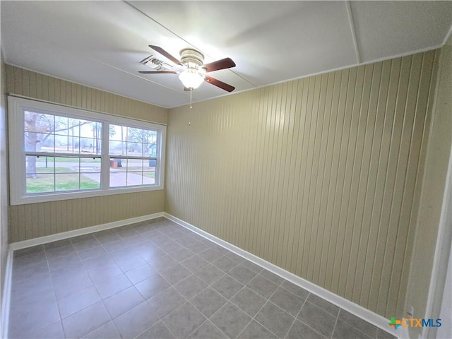 unfurnished room featuring ceiling fan