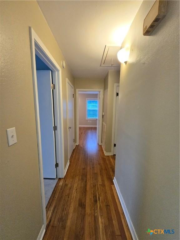 hall featuring dark wood-type flooring