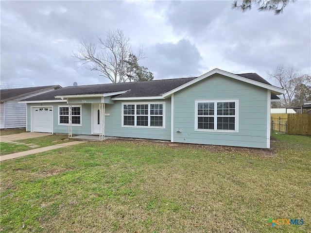 ranch-style house with a garage and a front lawn