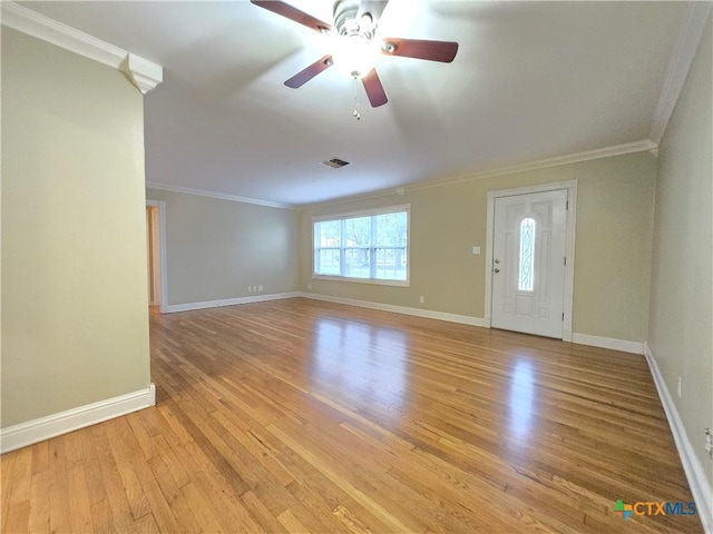 interior space with ceiling fan, ornamental molding, and light hardwood / wood-style floors