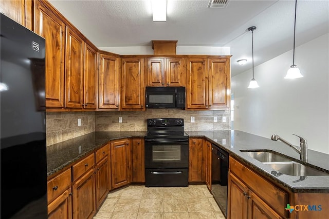 1102 Indian Mallow Dr, Temple, TX 76502 - kitchen featuring backsplash, a sink, brown cabinets, and black appliances