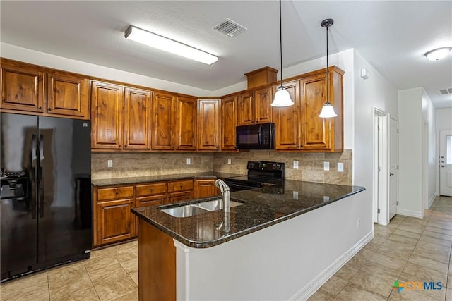 1102 Indian Mallow Dr, Temple, TX 76502 - kitchen featuring brown cabinets, visible vents, a sink, and black appliances