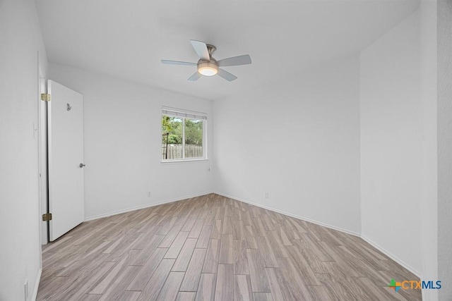 9100 Brimstone Ln, Austin, TX 78717 - unfurnished room featuring ceiling fan, light wood finished floors, and baseboards