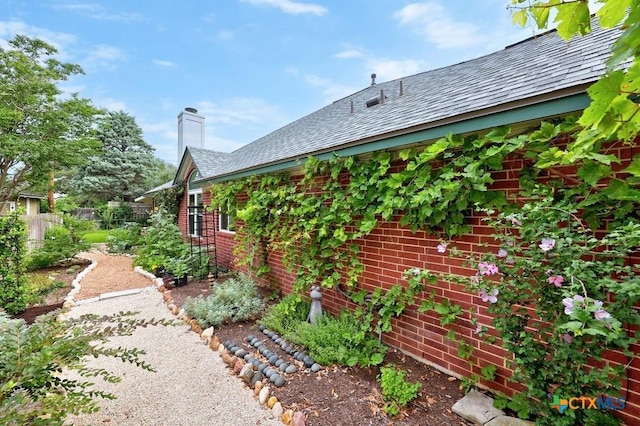 9100 Brimstone Ln, Austin, TX 78717 - view of property exterior featuring brick siding and a chimney