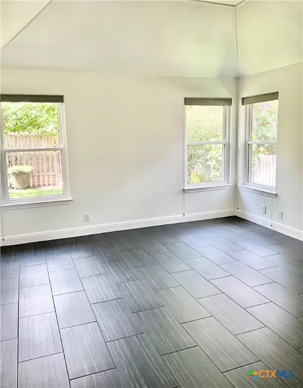 9100 Brimstone Ln, Austin, TX 78717 - unfurnished room with plenty of natural light and wood finish floors