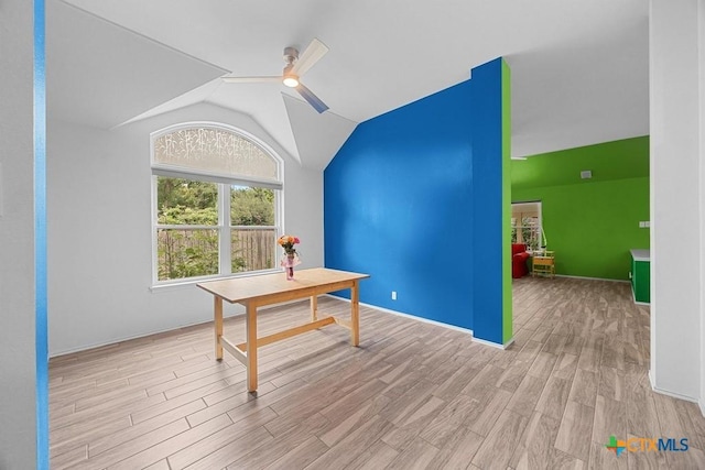 9100 Brimstone Ln, Austin, TX 78717 - home office with wood finished floors, lofted ceiling, a ceiling fan, and baseboards