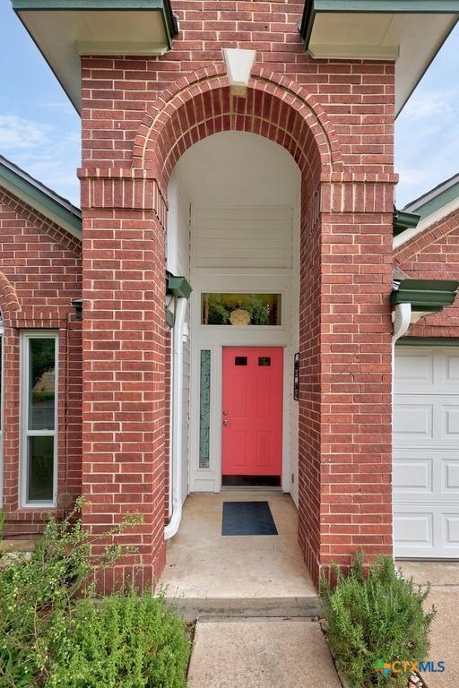 9100 Brimstone Ln, Austin, TX 78717 - property entrance with brick siding