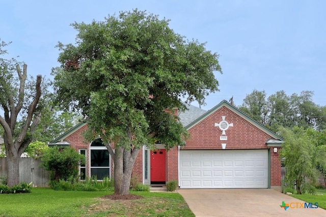 9100 Brimstone Ln, Austin, TX 78717 - view of front of home with a garage, concrete driveway, and brick siding