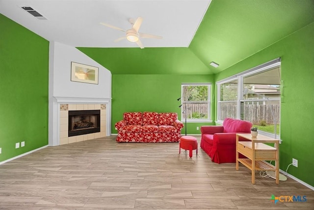9100 Brimstone Ln, Austin, TX 78717 - living area featuring ceiling fan, vaulted ceiling, a fireplace, and baseboards