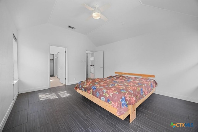 9100 Brimstone Ln, Austin, TX 78717 - bedroom with vaulted ceiling, baseboards, and ceiling fan