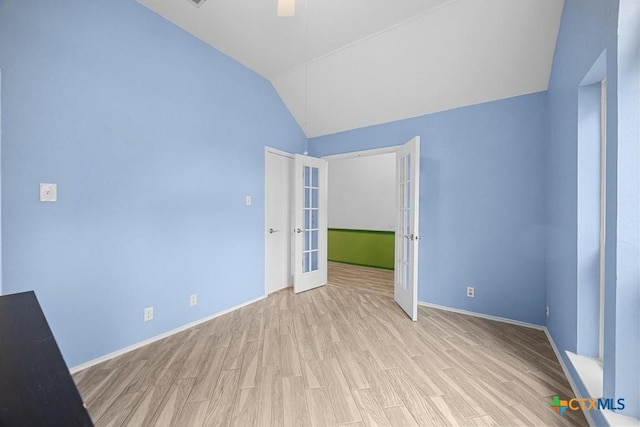 9100 Brimstone Ln, Austin, TX 78717 - spare room featuring light wood-type flooring, lofted ceiling, ceiling fan, french doors, and baseboards