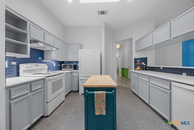 9100 Brimstone Ln, Austin, TX 78717 - kitchen with white appliances, under cabinet range hood, butcher block counters, backsplash, and open shelves