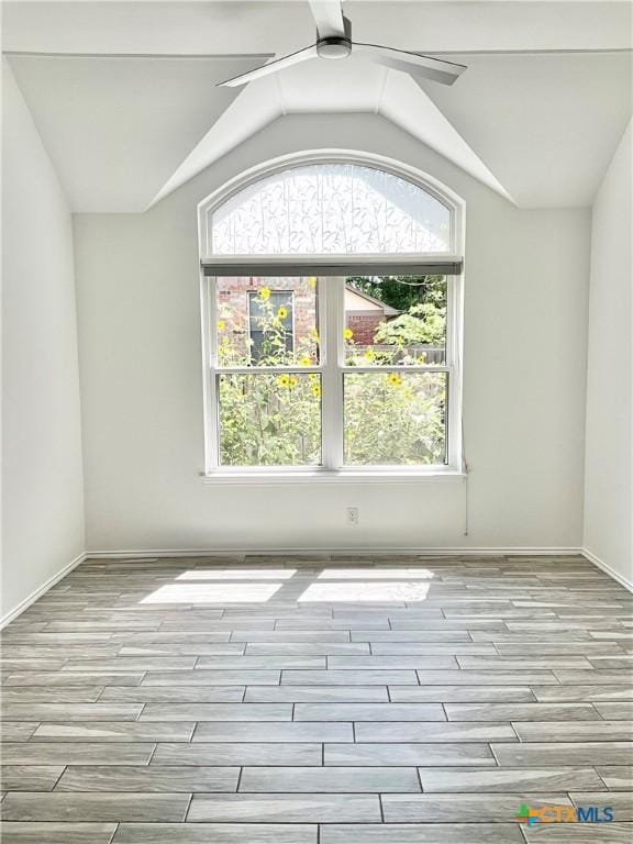 9100 Brimstone Ln, Austin, TX 78717 - spare room with ceiling fan, wood finished floors, and vaulted ceiling