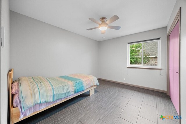 9100 Brimstone Ln, Austin, TX 78717 - back of property featuring a patio area, a ceiling fan, and a vegetable garden