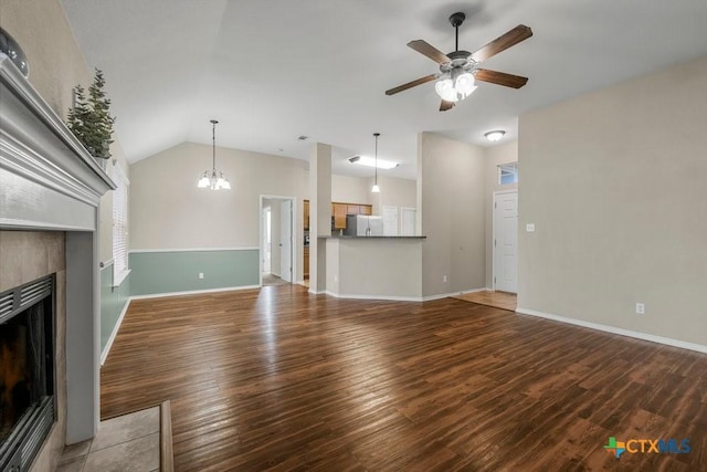 1117 Branchwood Way, Temple, TX 76502 - unfurnished living room featuring a fireplace, ceiling fan, wood finished floors, a chandelier, and lofted ceiling
