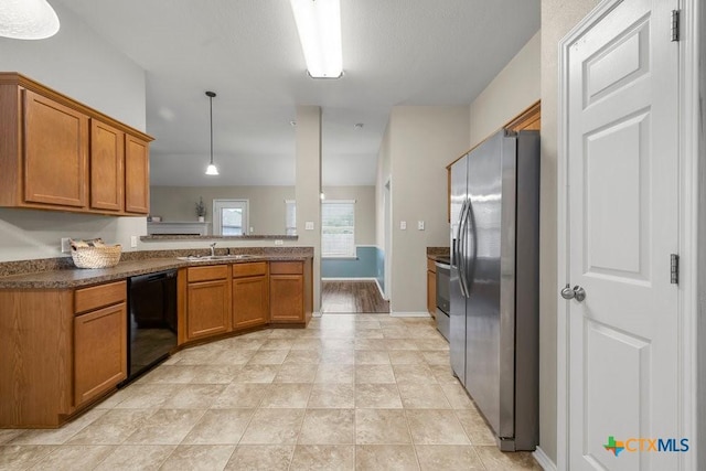 1117 Branchwood Way, Temple, TX 76502 - kitchen featuring stainless steel fridge with ice dispenser, black dishwasher, brown cabinetry, dark countertops, and hanging light fixtures