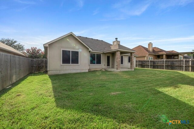1117 Branchwood Way, Temple, TX 76502 - back of property featuring a fenced backyard, a patio, and roof with shingles