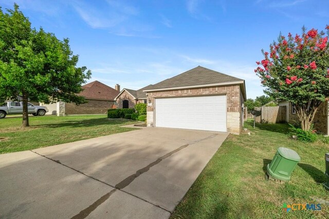 1117 Branchwood Way, Temple, TX 76502 - view of front of property featuring brick siding, a front yard, and driveway