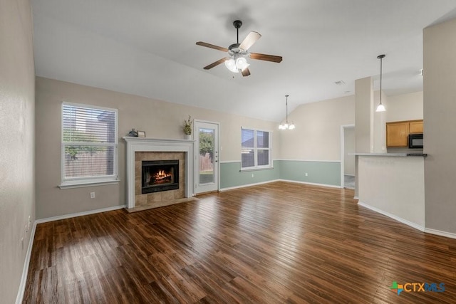 1117 Branchwood Way, Temple, TX 76502 - unfurnished living room with plenty of natural light, lofted ceiling, dark wood-style flooring, ceiling fan, and a fireplace