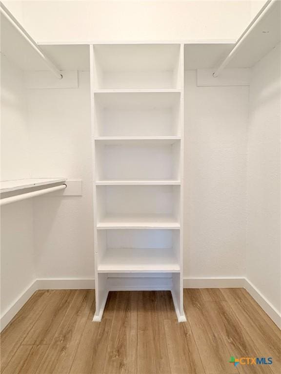 4310 Antelope Trl, Temple, TX 76504 - walk in closet featuring wood finished floors