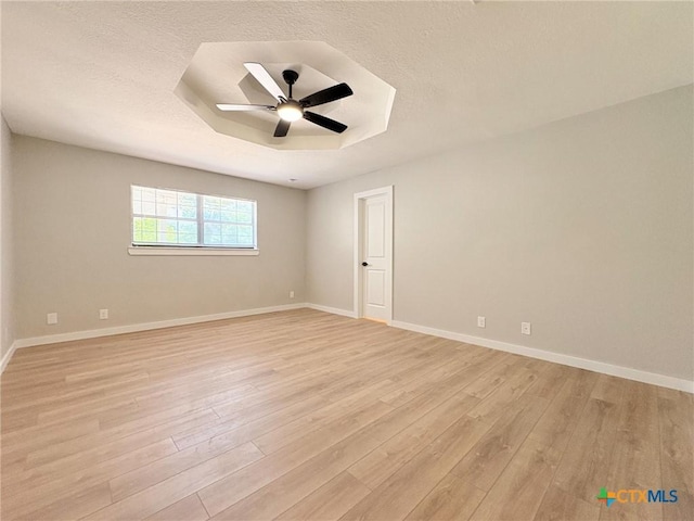 4310 Antelope Trl, Temple, TX 76504 - unfurnished room with light wood-type flooring, a ceiling fan, and a textured ceiling