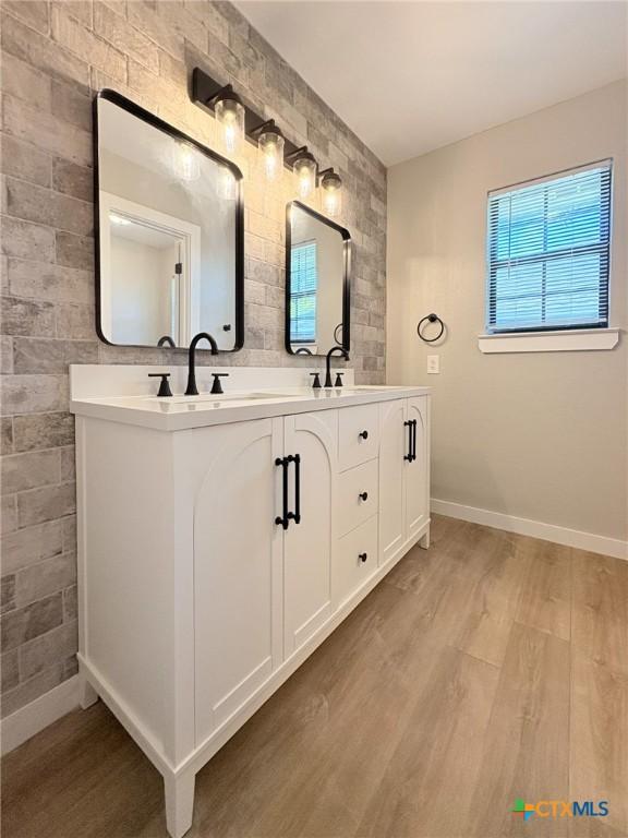 4310 Antelope Trl, Temple, TX 76504 - bathroom with double vanity and wood finished floors