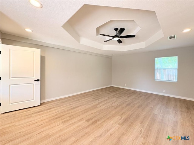 4310 Antelope Trl, Temple, TX 76504 - spare room with a raised ceiling, a ceiling fan, light wood finished floors, and recessed lighting