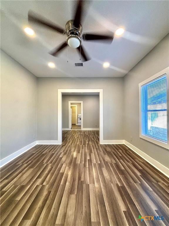 unfurnished room featuring dark hardwood / wood-style flooring and ceiling fan