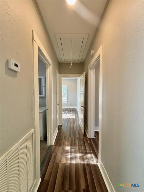 hallway featuring dark hardwood / wood-style floors