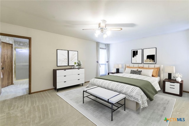 bedroom with a ceiling fan, light carpet, and baseboards