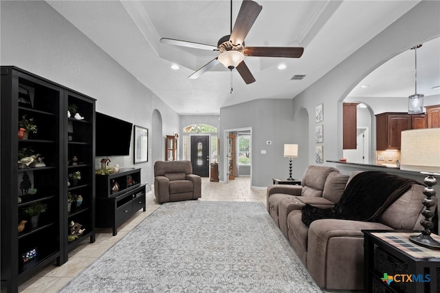 721 Gallagher Dr, Canyon Lake, TX 78133 - living area featuring arched walkways, ceiling fan, a raised ceiling, recessed lighting, and light tile patterned floors