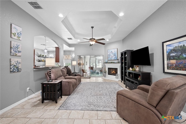 721 Gallagher Dr, Canyon Lake, TX 78133 - living area featuring a ceiling fan, recessed lighting, arched walkways, baseboards, and light tile patterned floors